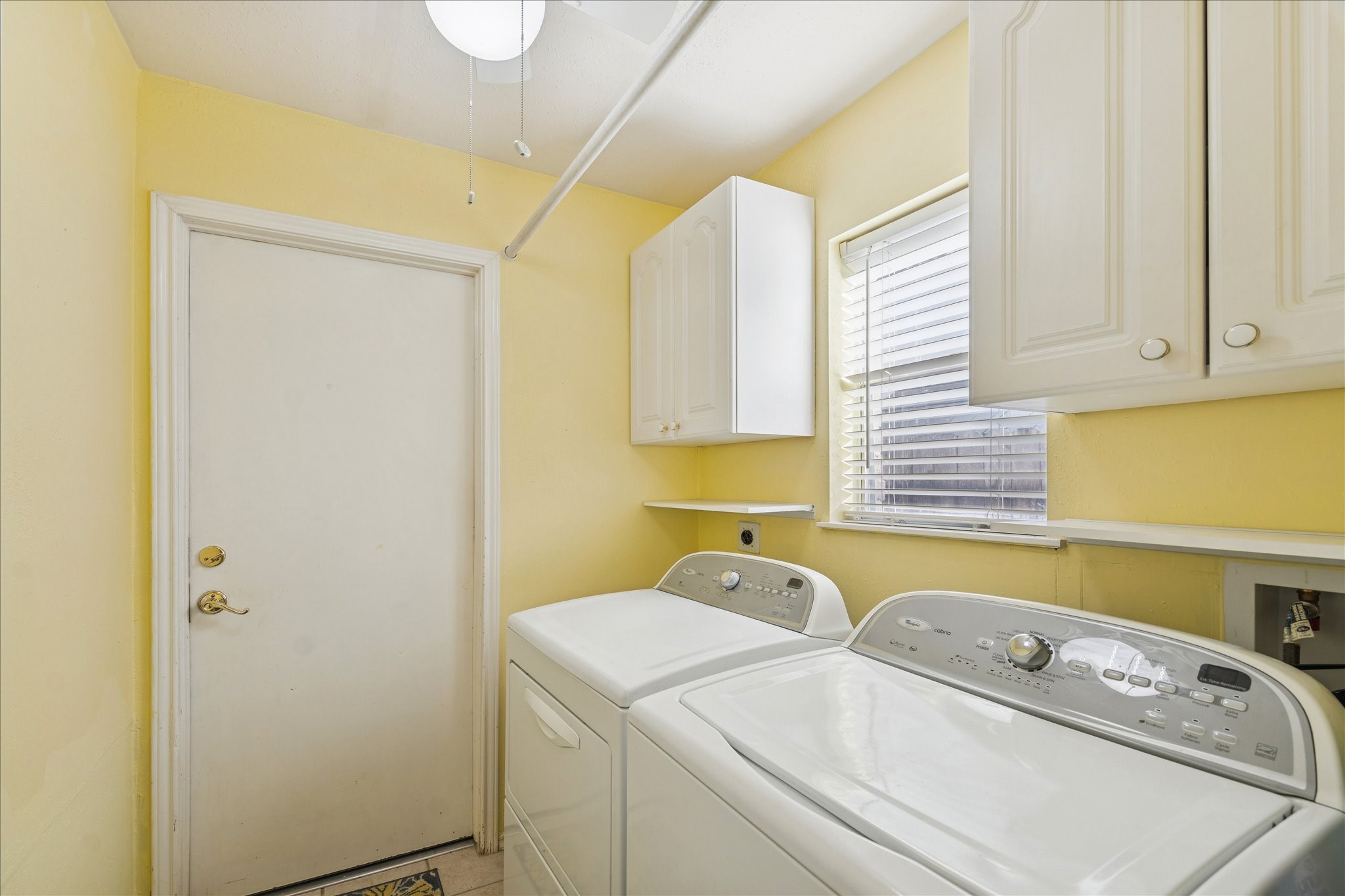 24919 Bovington Drive Spring, TX 77389 - Photo 18 of 21 a utility room with dryer and washer