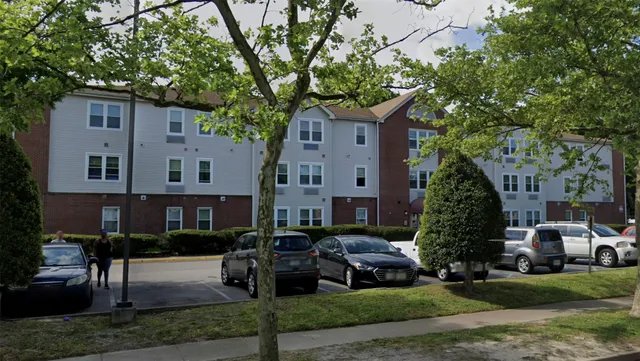 a bench sitting in front of a building