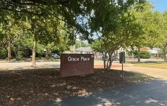 a sign board with tree
