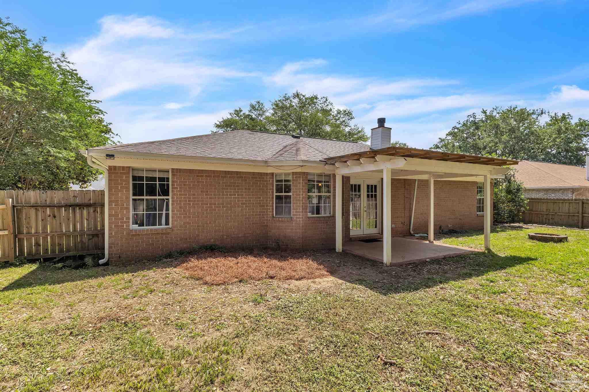 4321 Ridgeland Drive Pace, FL 32571 - Photo 34 of 36 front view of a house with a yard