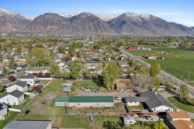 49 North 2830th West, Unit 3 Provo, UT 84601 - Photo 9 of 13 Aerial view of property's location with mountains and nearby suburban area