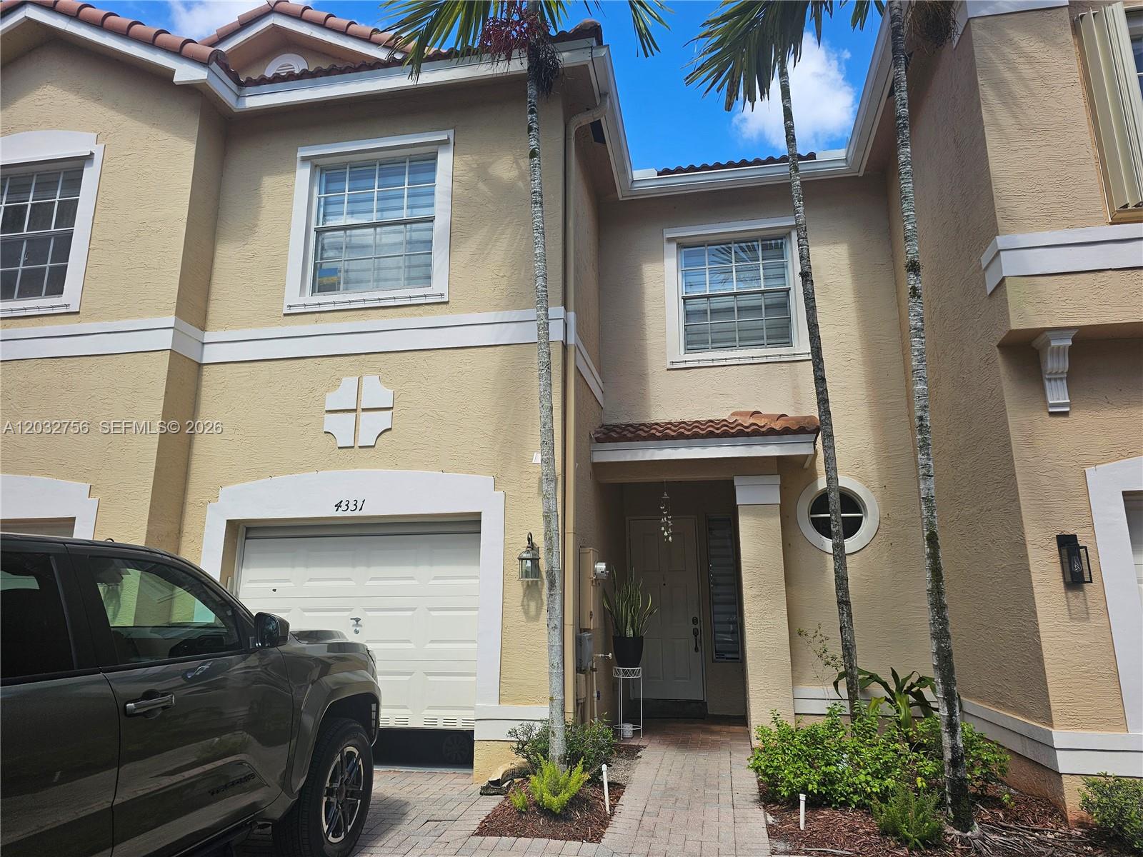 4331 Southwest 124th Way Miramar, FL 33027 - Photo 26 of 40 a front view of a house with a garage