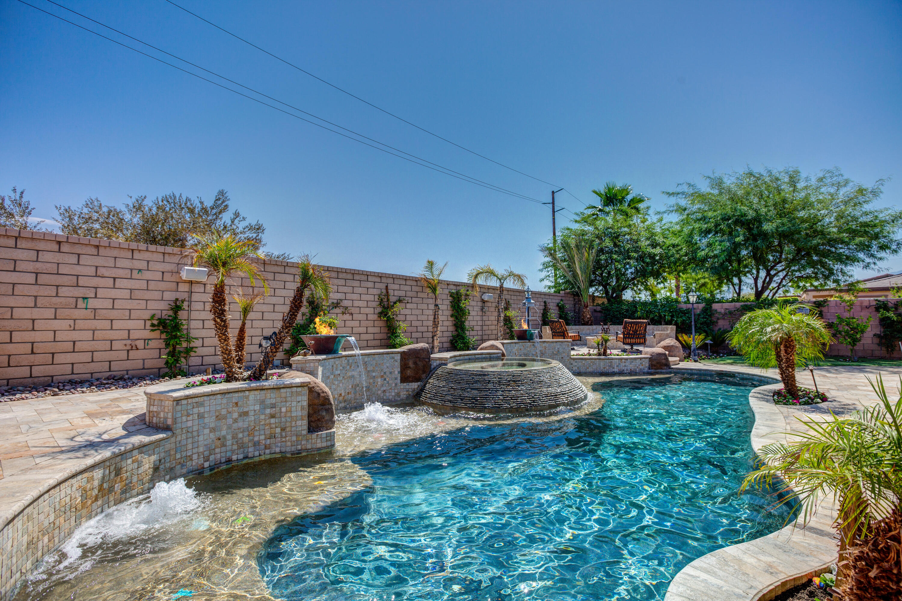 a view of backyard with seating area and green space