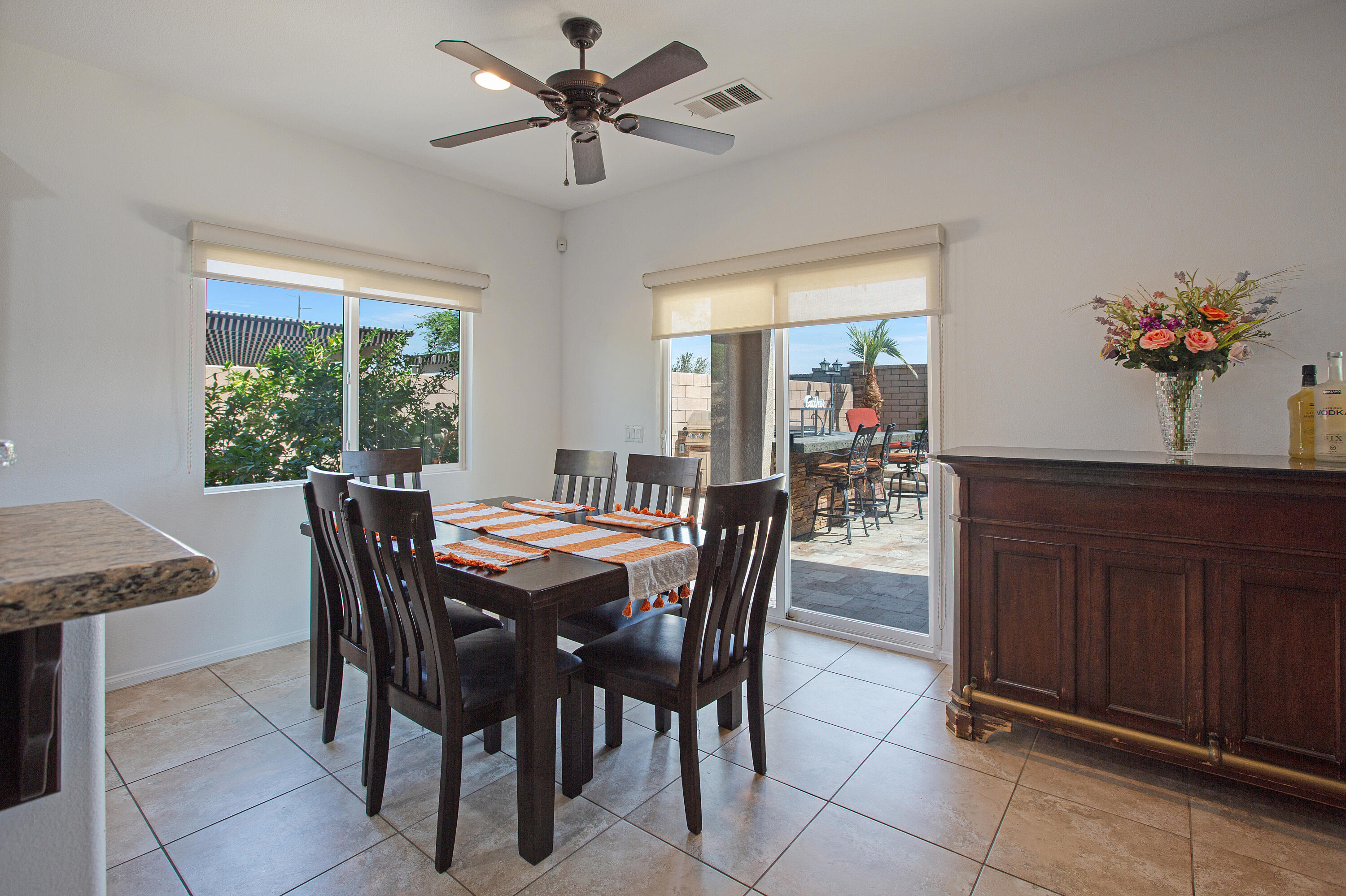 35922 Raphael Drive Palm Desert, CA 92211 - Photo 11 of 33 a dining room with furniture a window and a chandelier