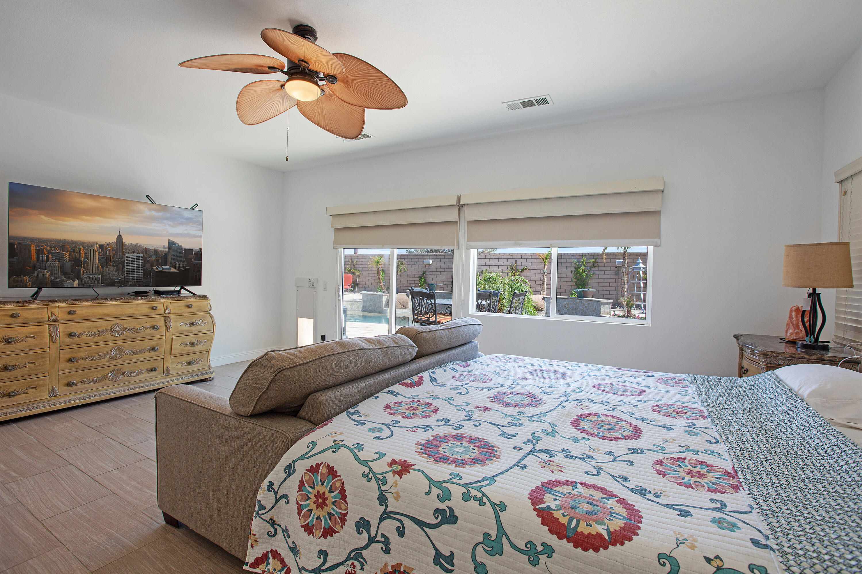 35922 Raphael Drive Palm Desert, CA 92211 - Photo 19 of 33 a bedroom with a bed and a chandelier