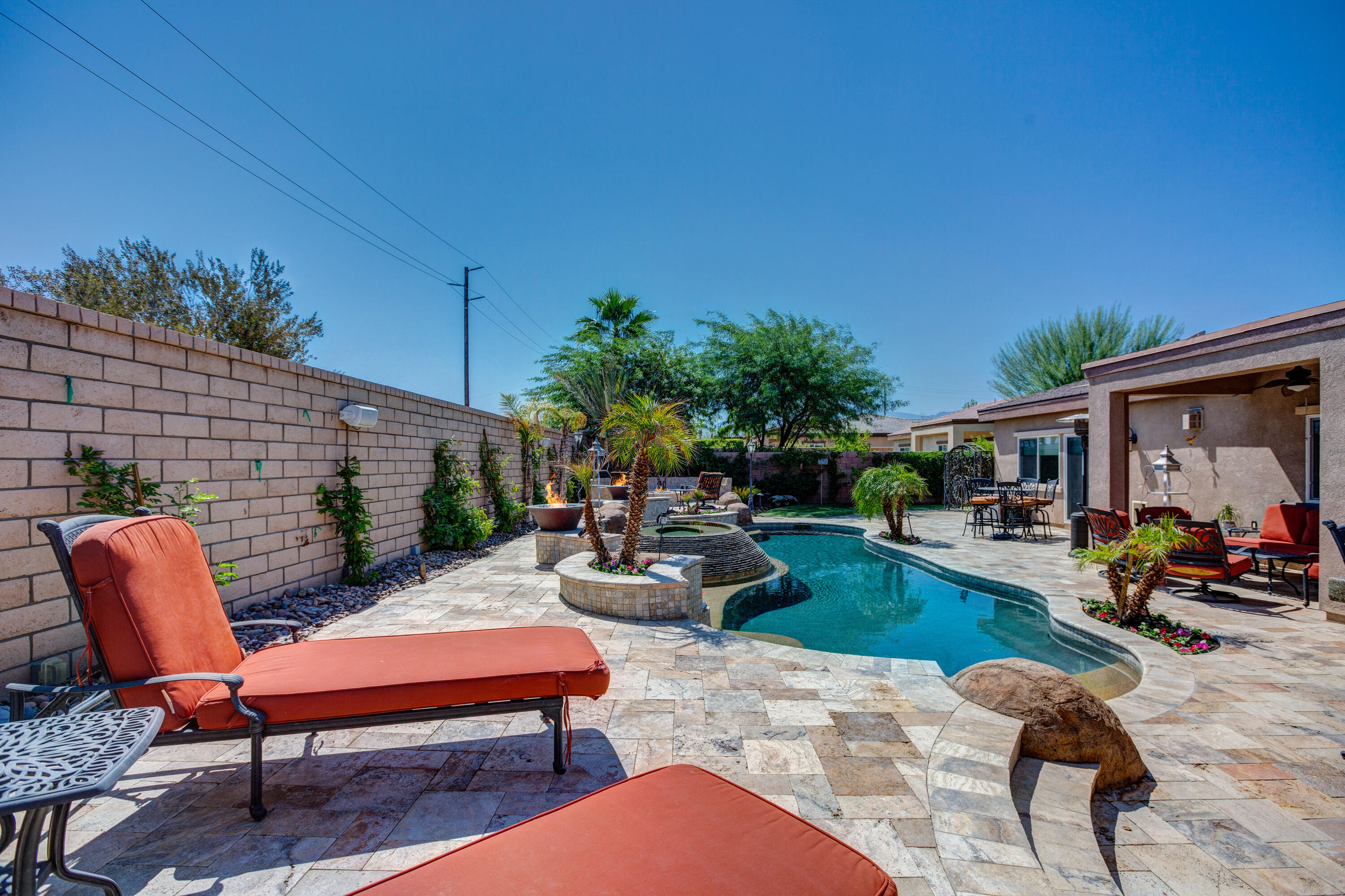 35922 Raphael Drive Palm Desert, CA 92211 - Photo 2 of 33 a backyard of a house with seating space