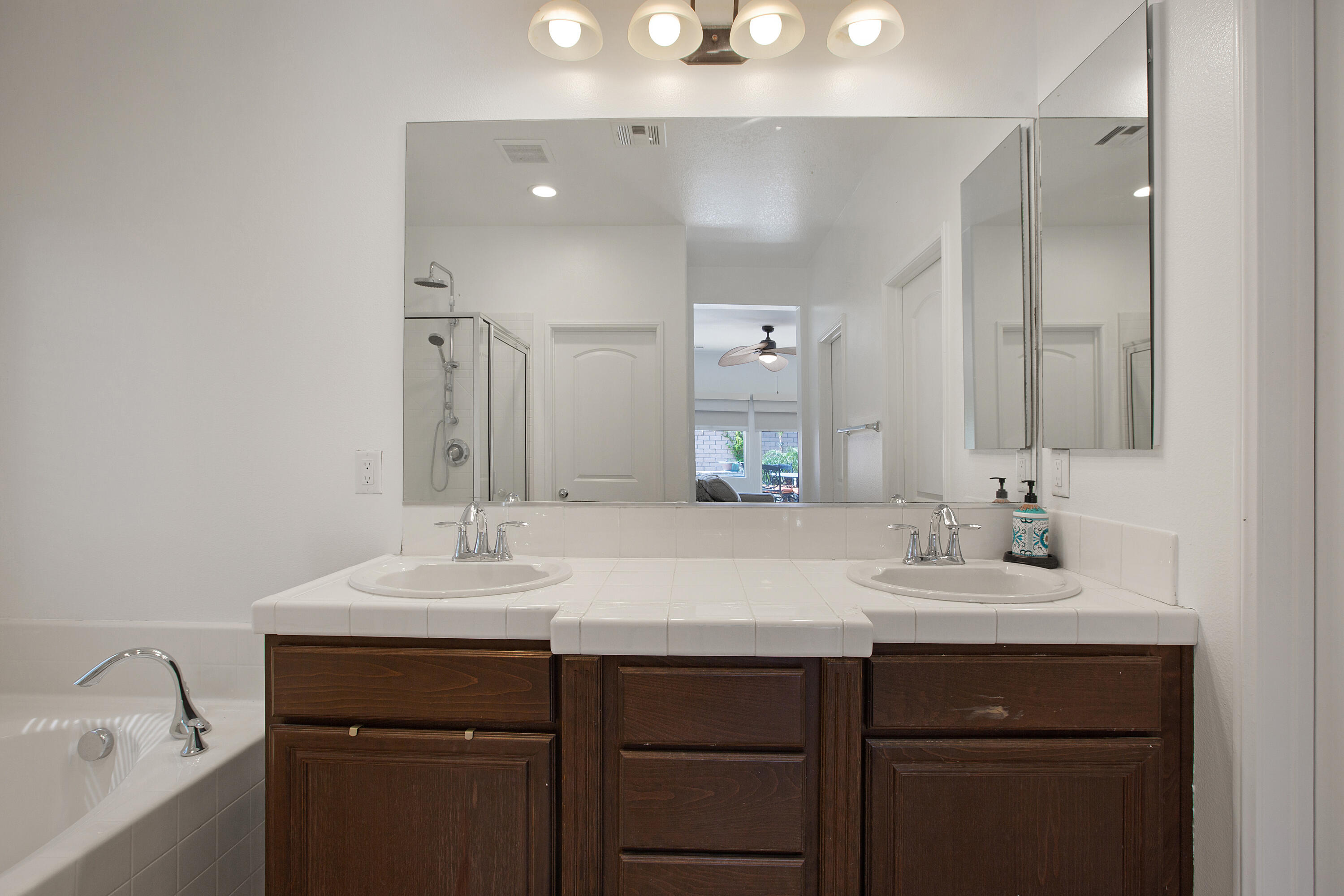 35922 Raphael Drive Palm Desert, CA 92211 - Photo 21 of 33 a bathroom with a sink and a mirror