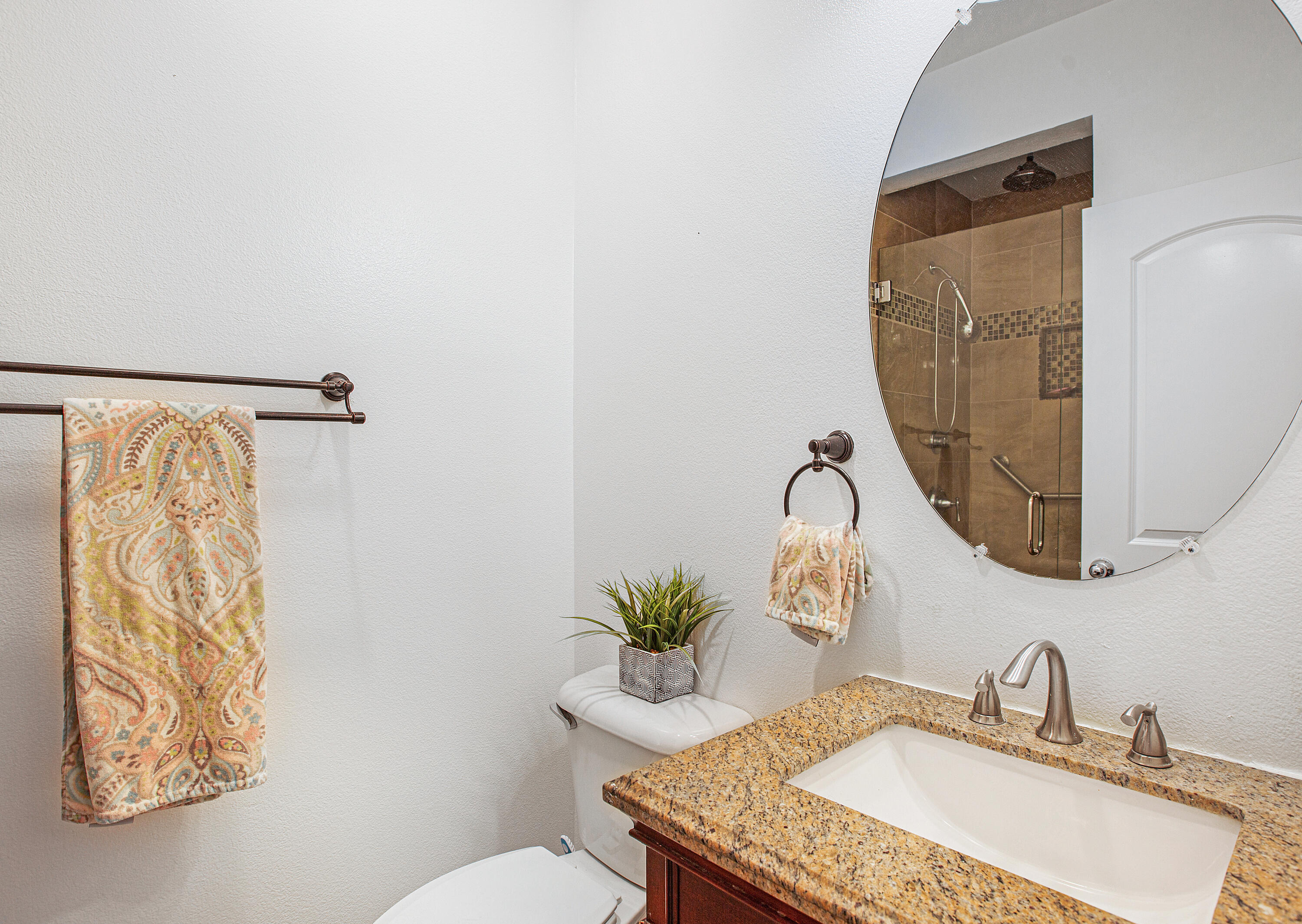 35922 Raphael Drive Palm Desert, CA 92211 - Photo 23 of 33 a bathroom with a granite countertop sink and a mirror