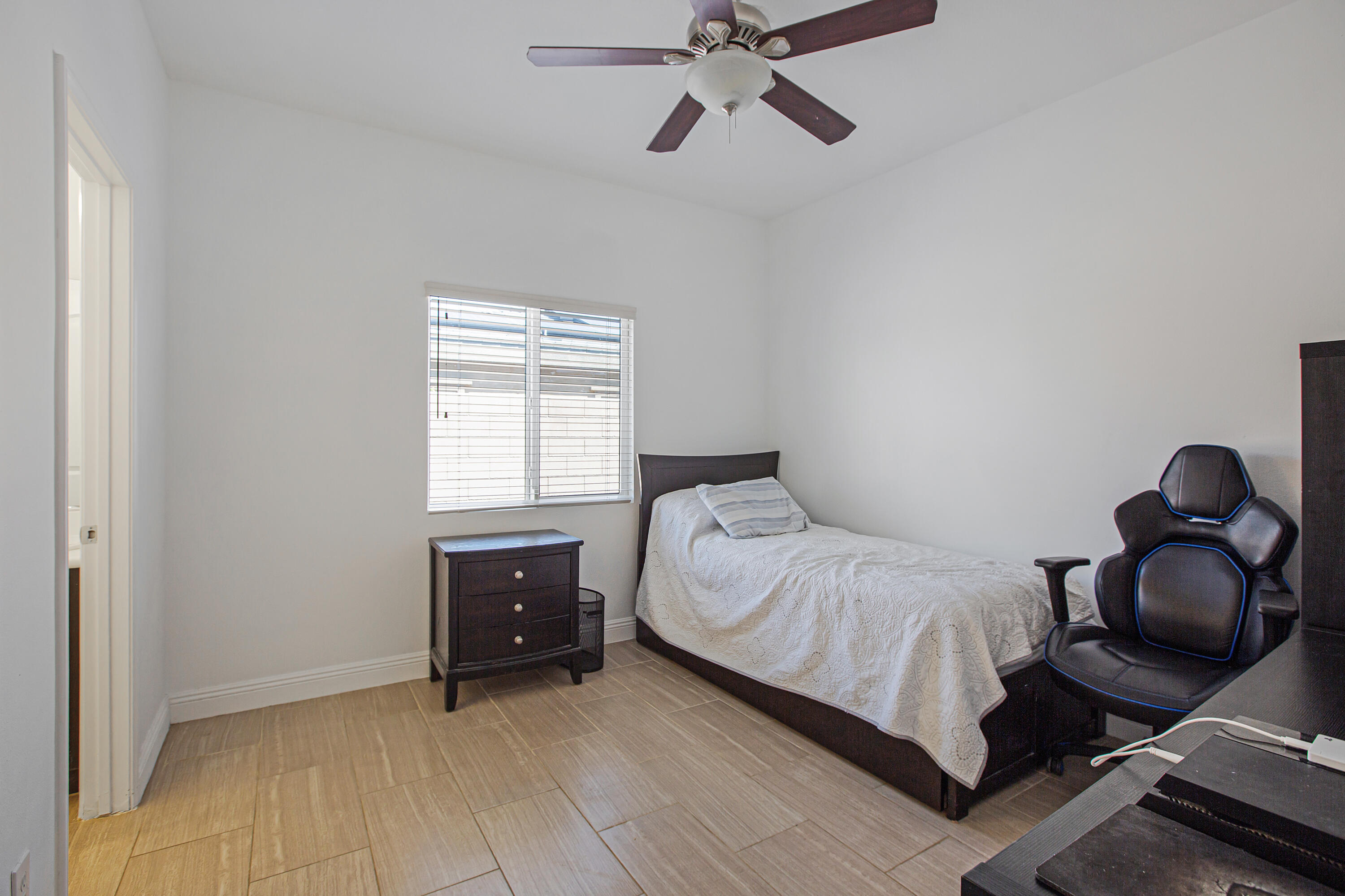 35922 Raphael Drive Palm Desert, CA 92211 - Photo 26 of 33 a bedroom with a bed and window