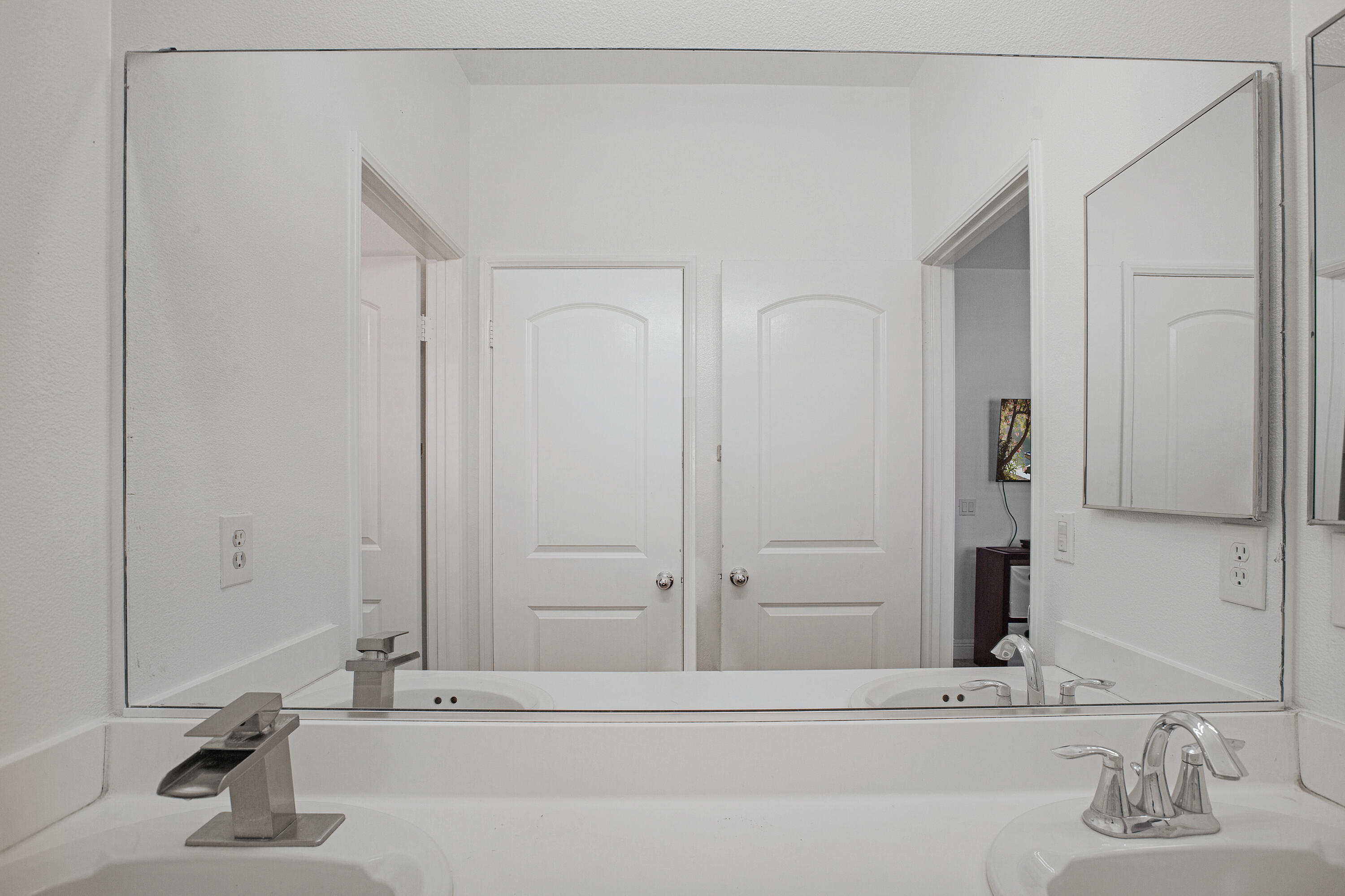 35922 Raphael Drive Palm Desert, CA 92211 - Photo 27 of 33 a bathroom with a sink and a mirror