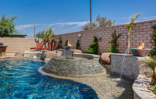 a view of a backyard with sitting area furniture and garden