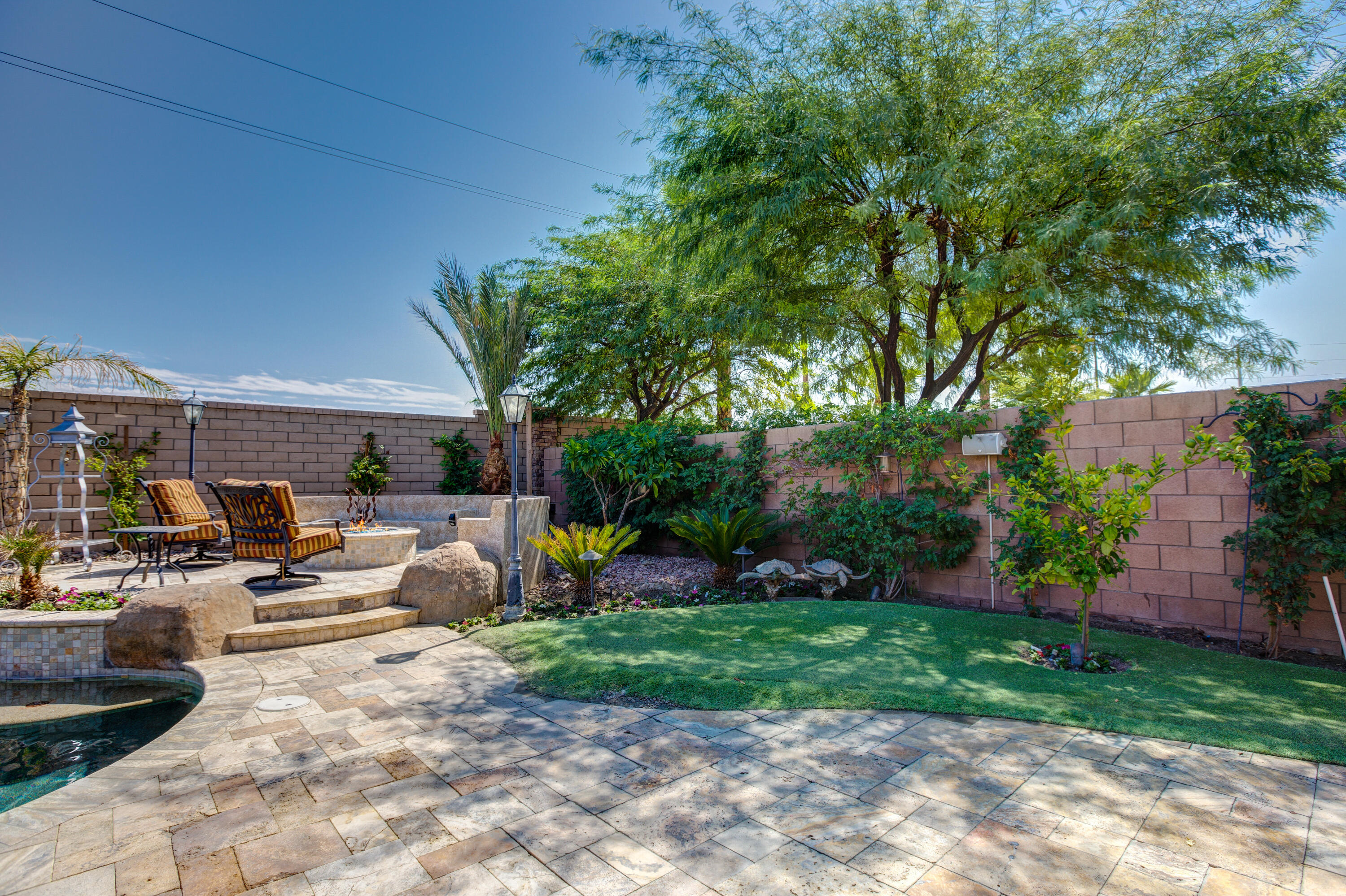 35922 Raphael Drive Palm Desert, CA 92211 - Photo 31 of 33 a view of a backyard with sitting area furniture and garden