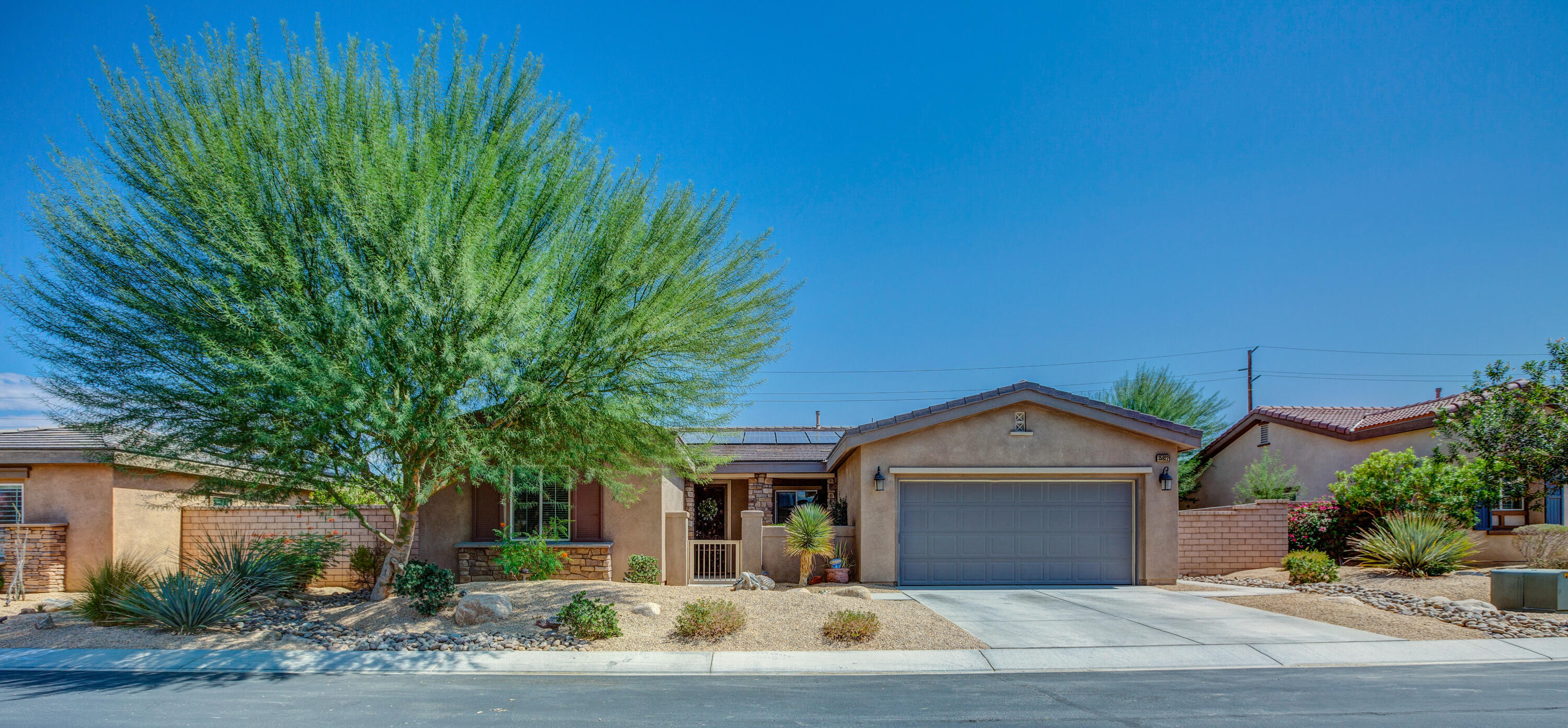 35922 Raphael Drive Palm Desert, CA 92211 - Photo 9 of 33 a view of a house with a yard and large tree