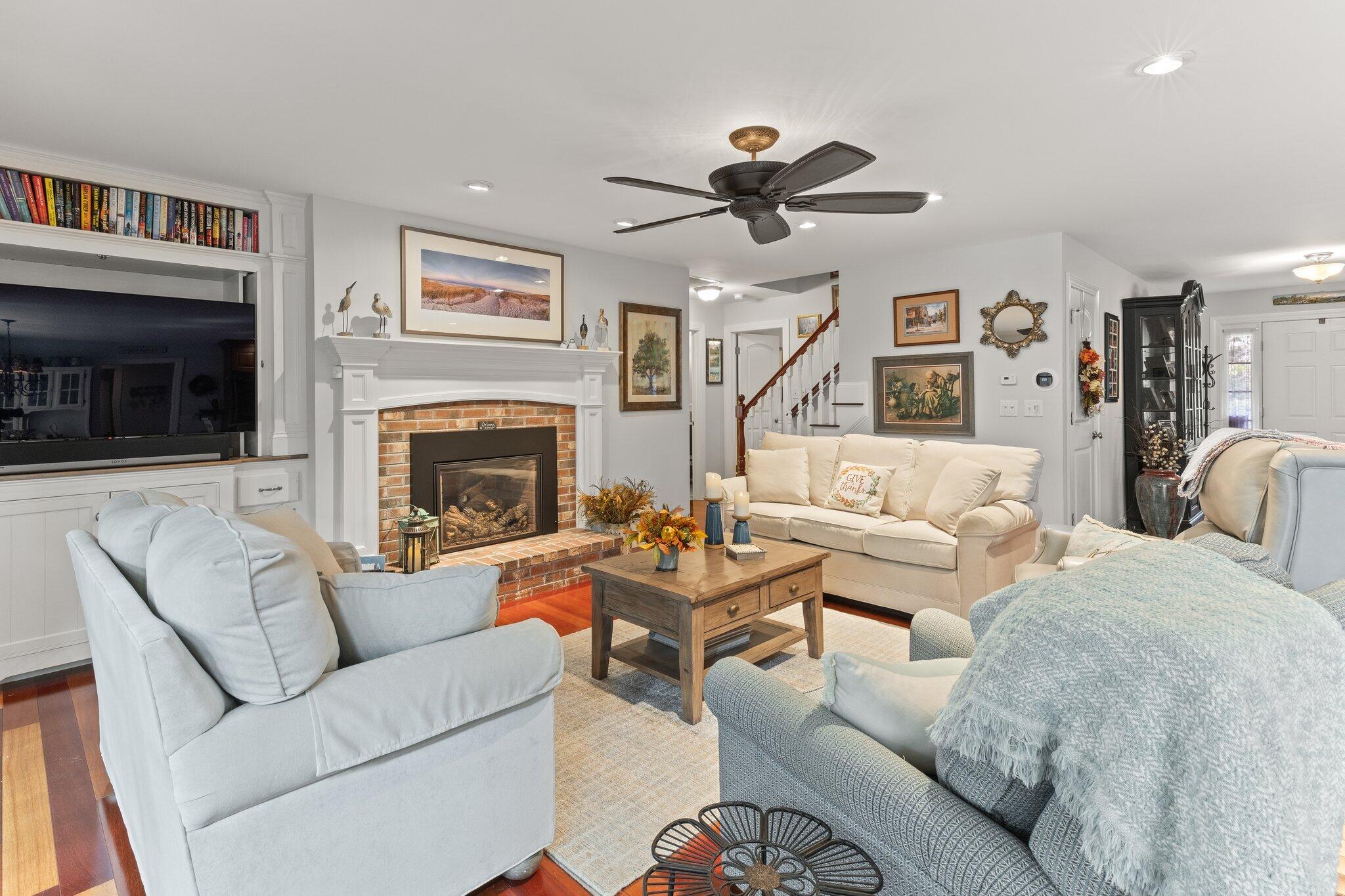 9 Briar Spring Road Orleans, MA 02653 - Photo 14 of 65 a living room with furniture a window and a fireplace