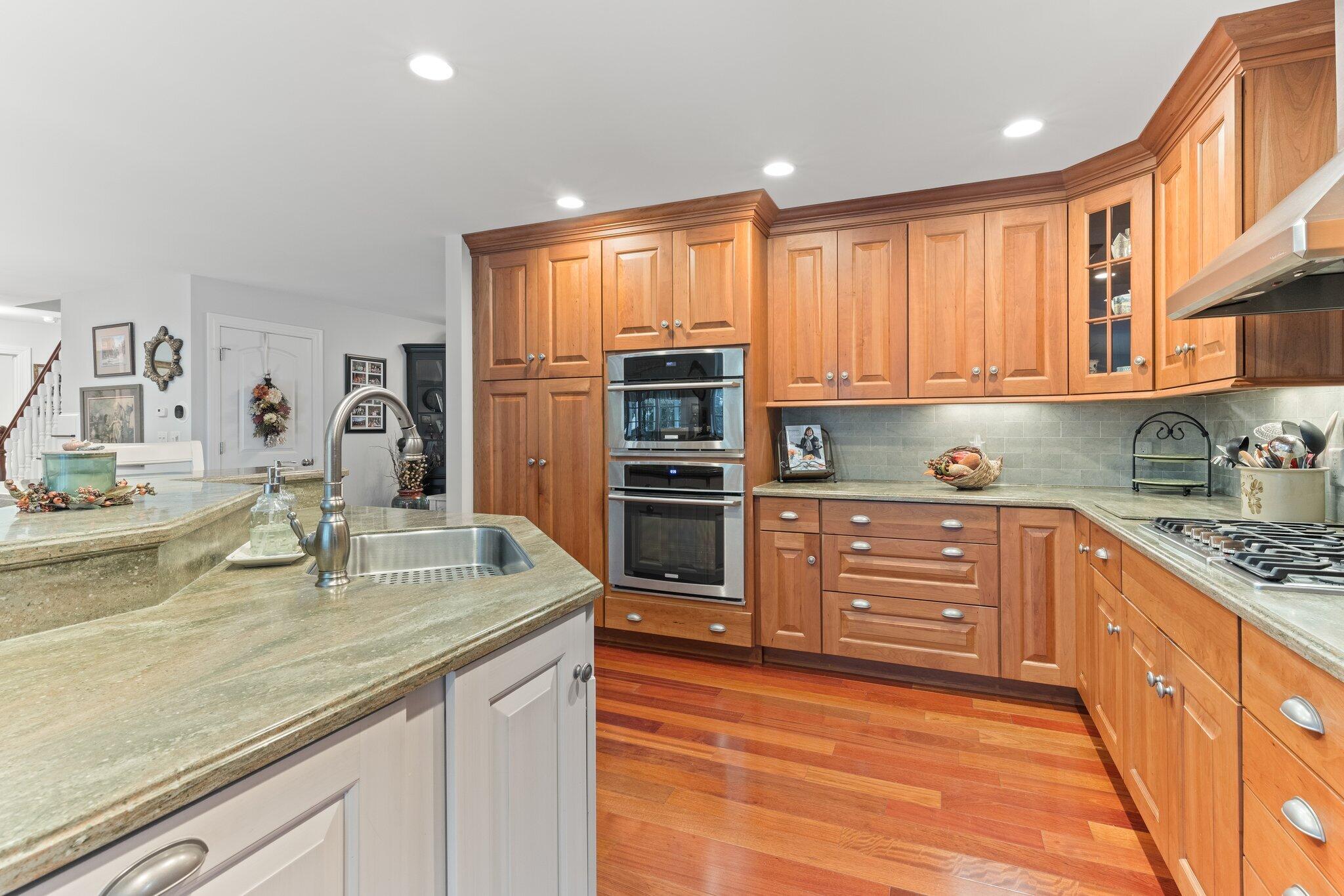 9 Briar Spring Road Orleans, MA 02653 - Photo 18 of 65 a kitchen with stainless steel appliances granite countertop a sink stove and refrigerator