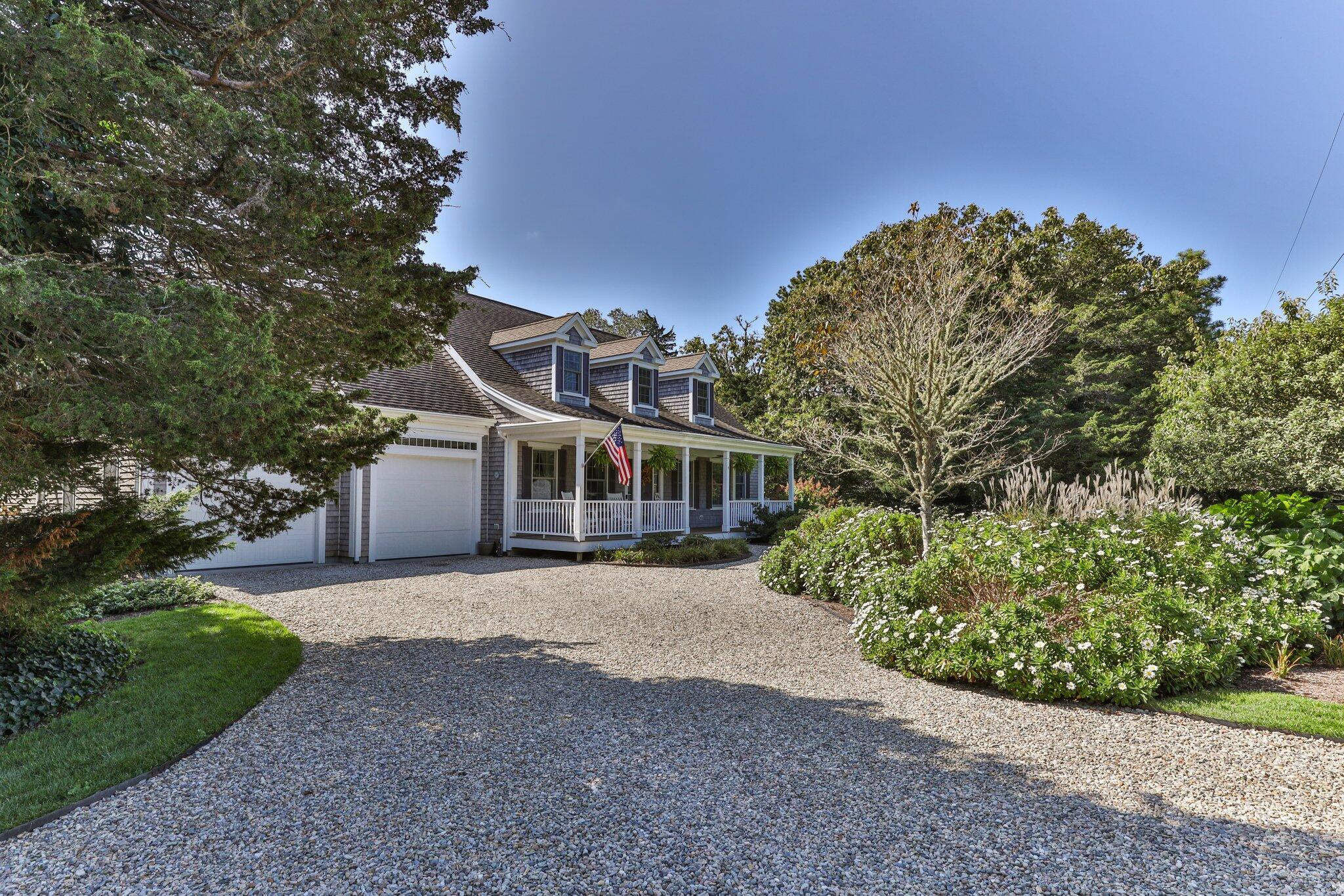 9 Briar Spring Road Orleans, MA 02653 - Photo 2 of 65 a front view of a house with a yard