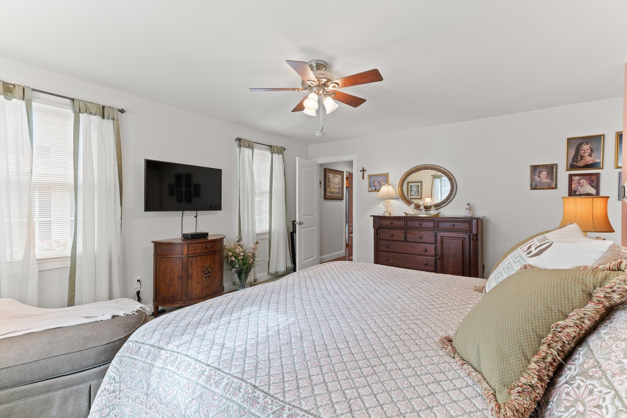 9 Briar Spring Road Orleans, MA 02653 - Photo 28 of 65 a bedroom with a bed and a flat screen tv