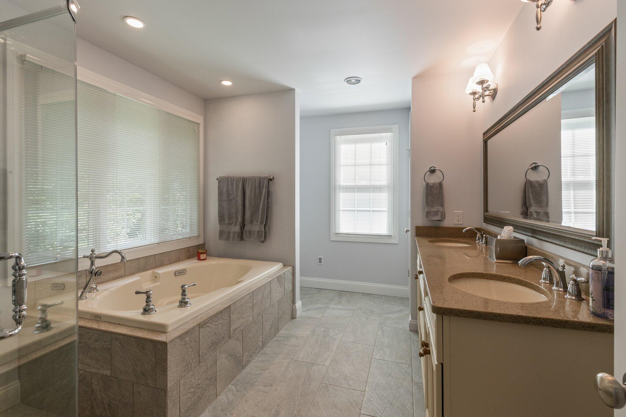 9 Briar Spring Road Orleans, MA 02653 - Photo 30 of 65 a bathroom with a tub sink and mirror