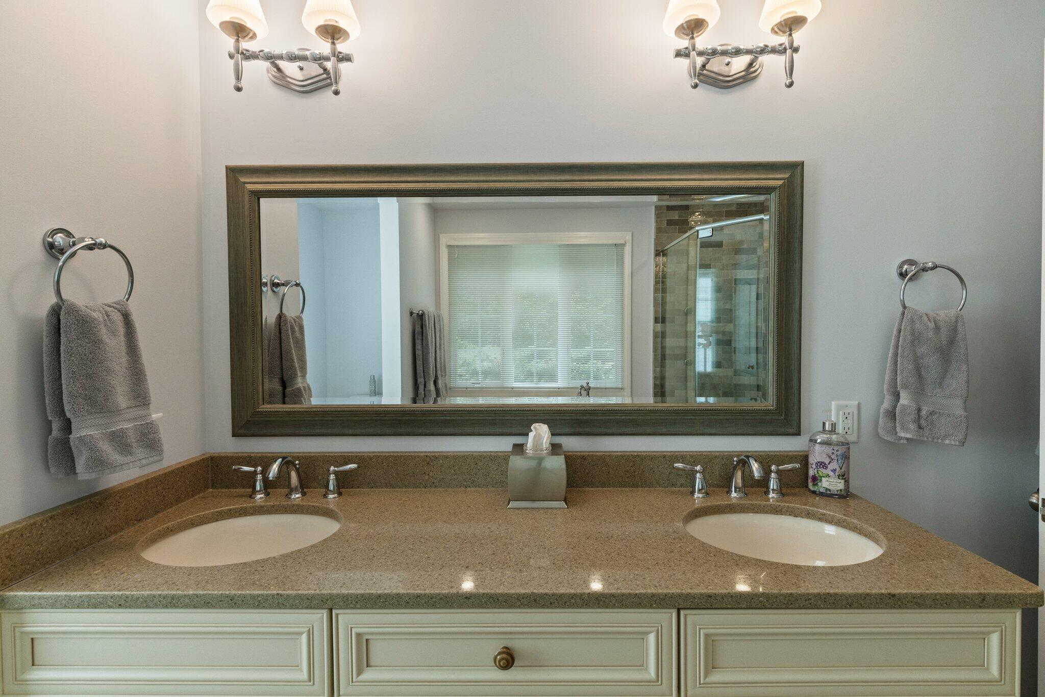 9 Briar Spring Road Orleans, MA 02653 - Photo 32 of 65 a bathroom with sinks and a mirror