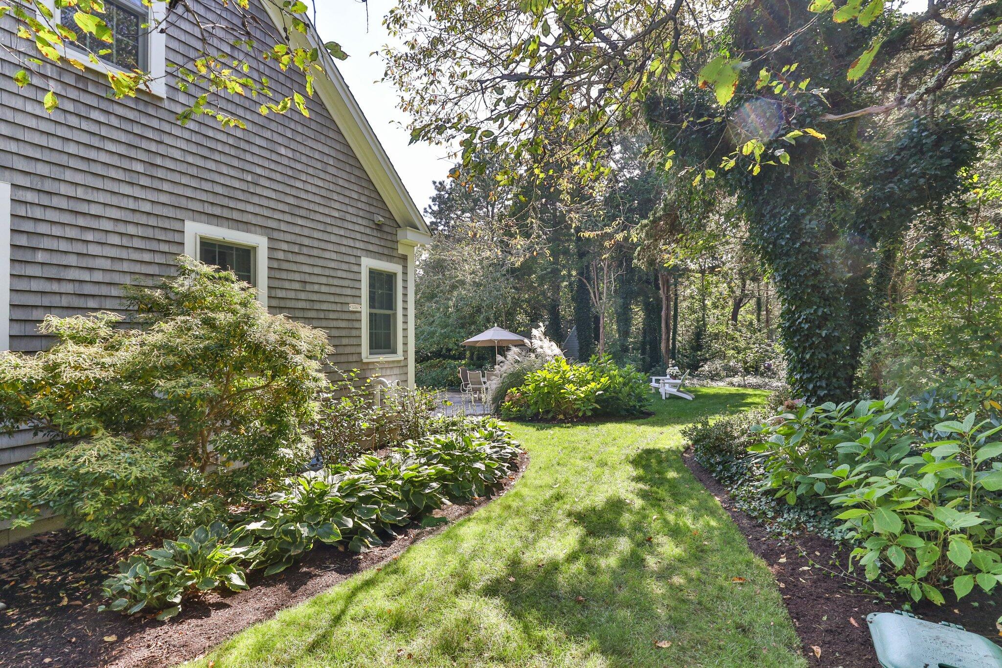 9 Briar Spring Road Orleans, MA 02653 - Photo 45 of 65 a view of backyard with garden and patio