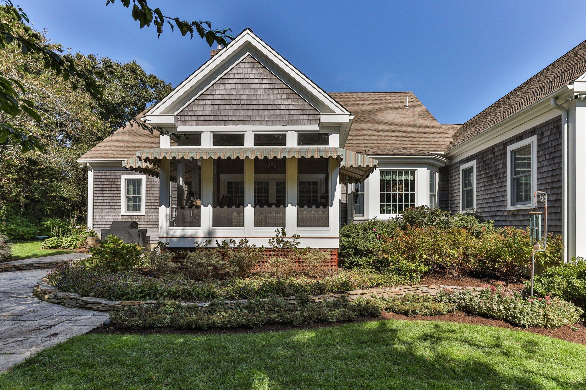 9 Briar Spring Road Orleans, MA 02653 - Photo 48 of 65 front view of a house with a yard