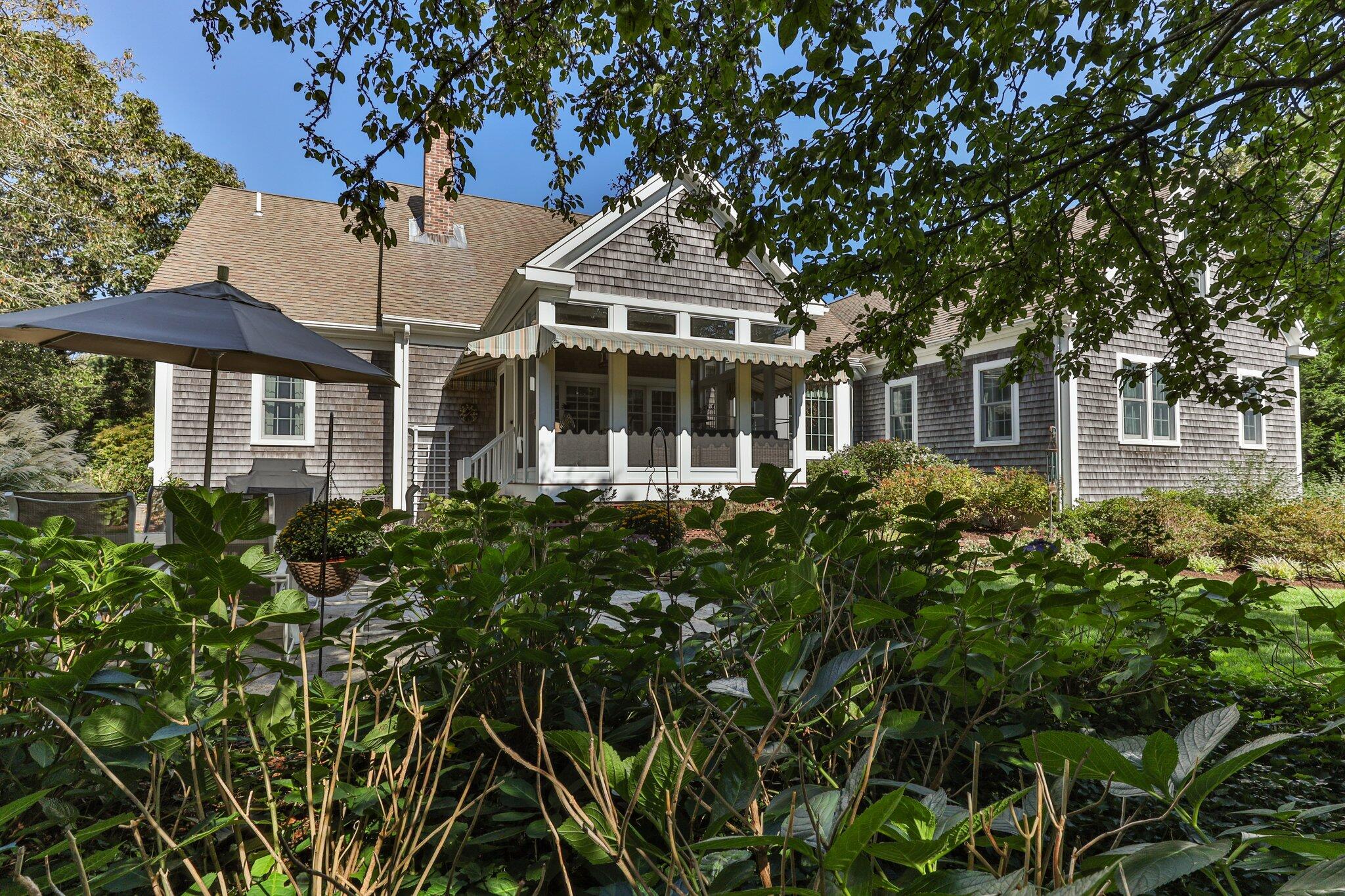 9 Briar Spring Road Orleans, MA 02653 - Photo 52 of 65 front view of a house with a garden
