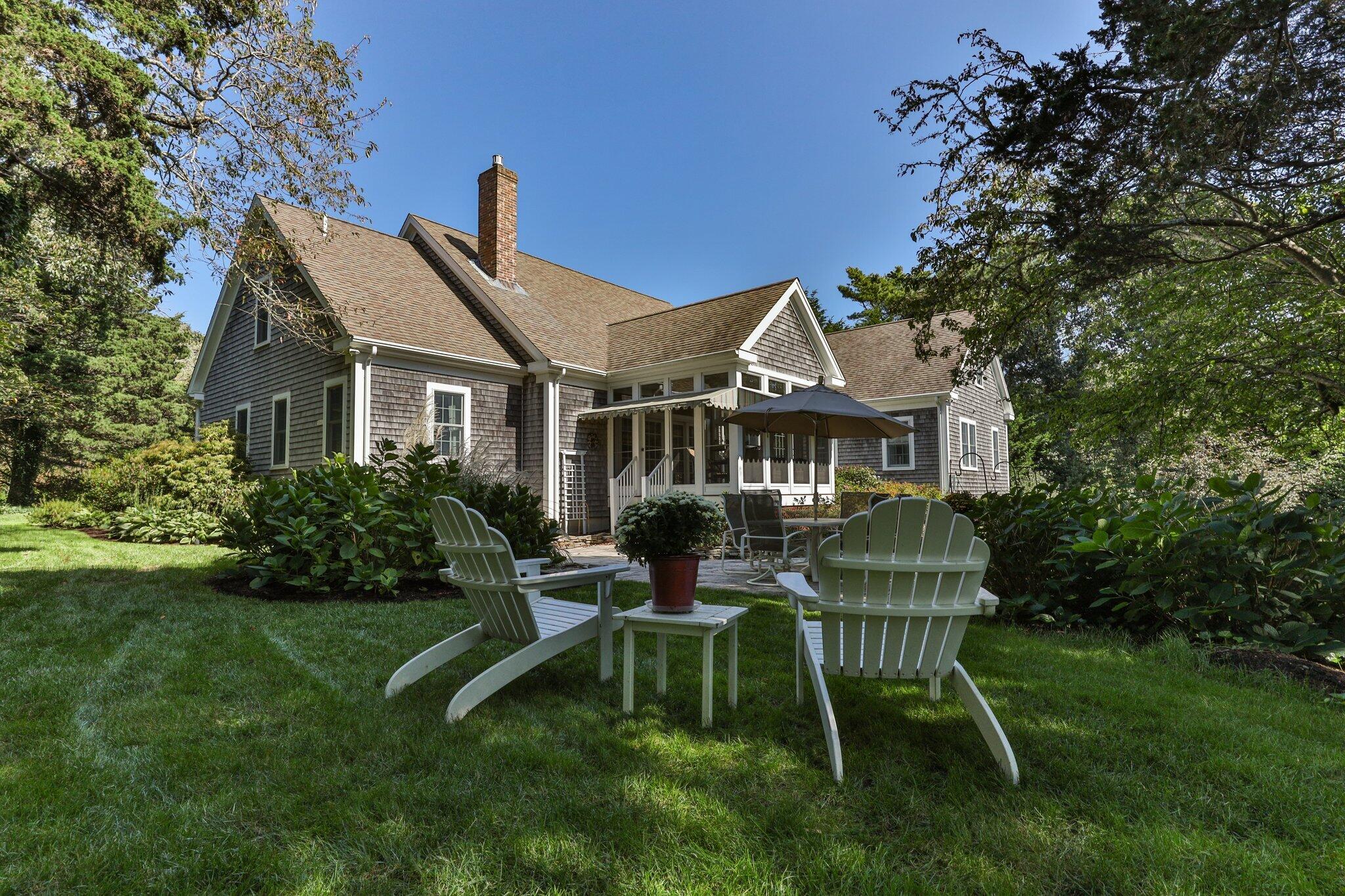 9 Briar Spring Road Orleans, MA 02653 - Photo 53 of 65 a view of a house with a yard patio and sitting area