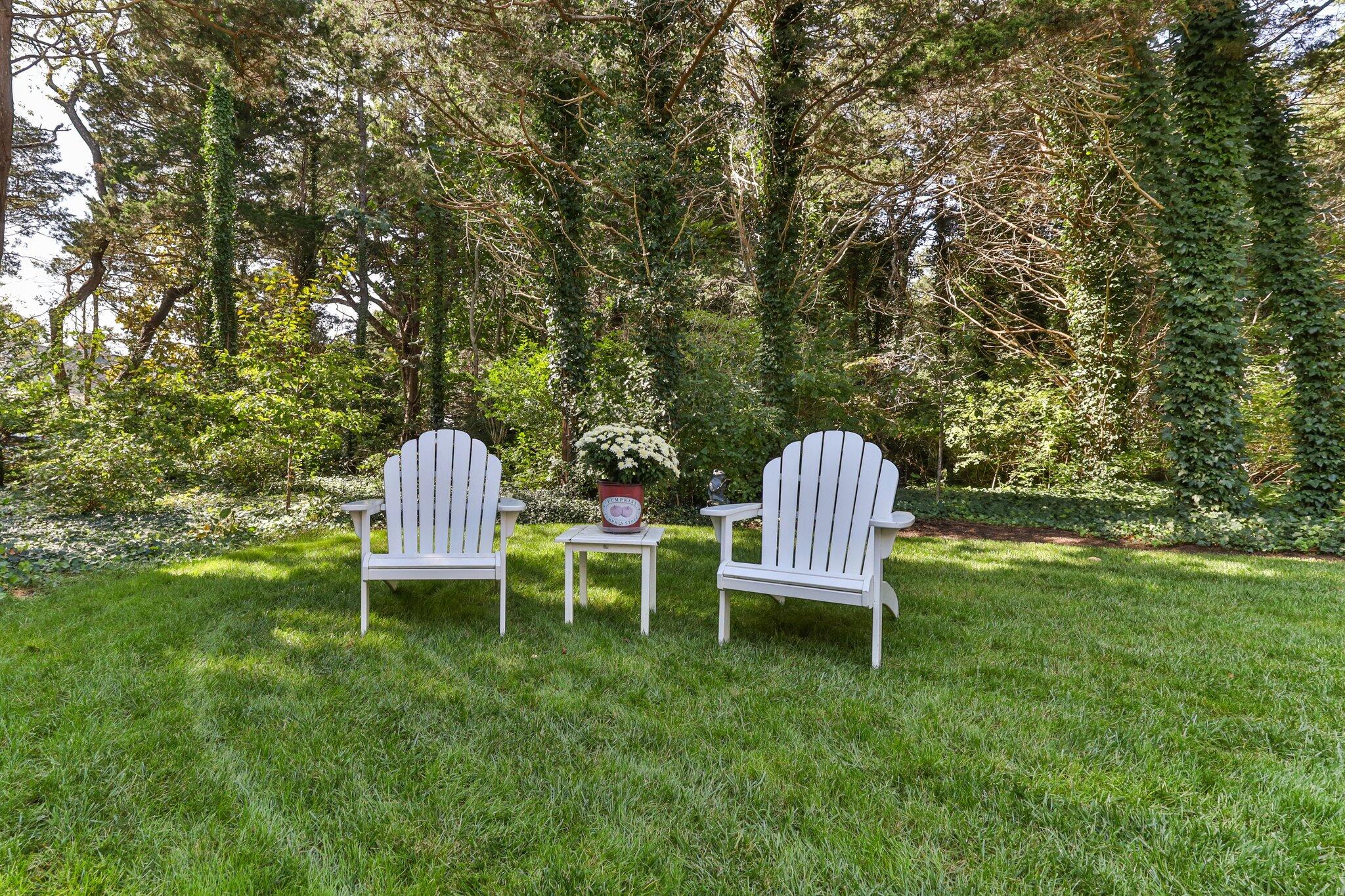 9 Briar Spring Road Orleans, MA 02653 - Photo 54 of 65 a view of a table and chairs in the garden