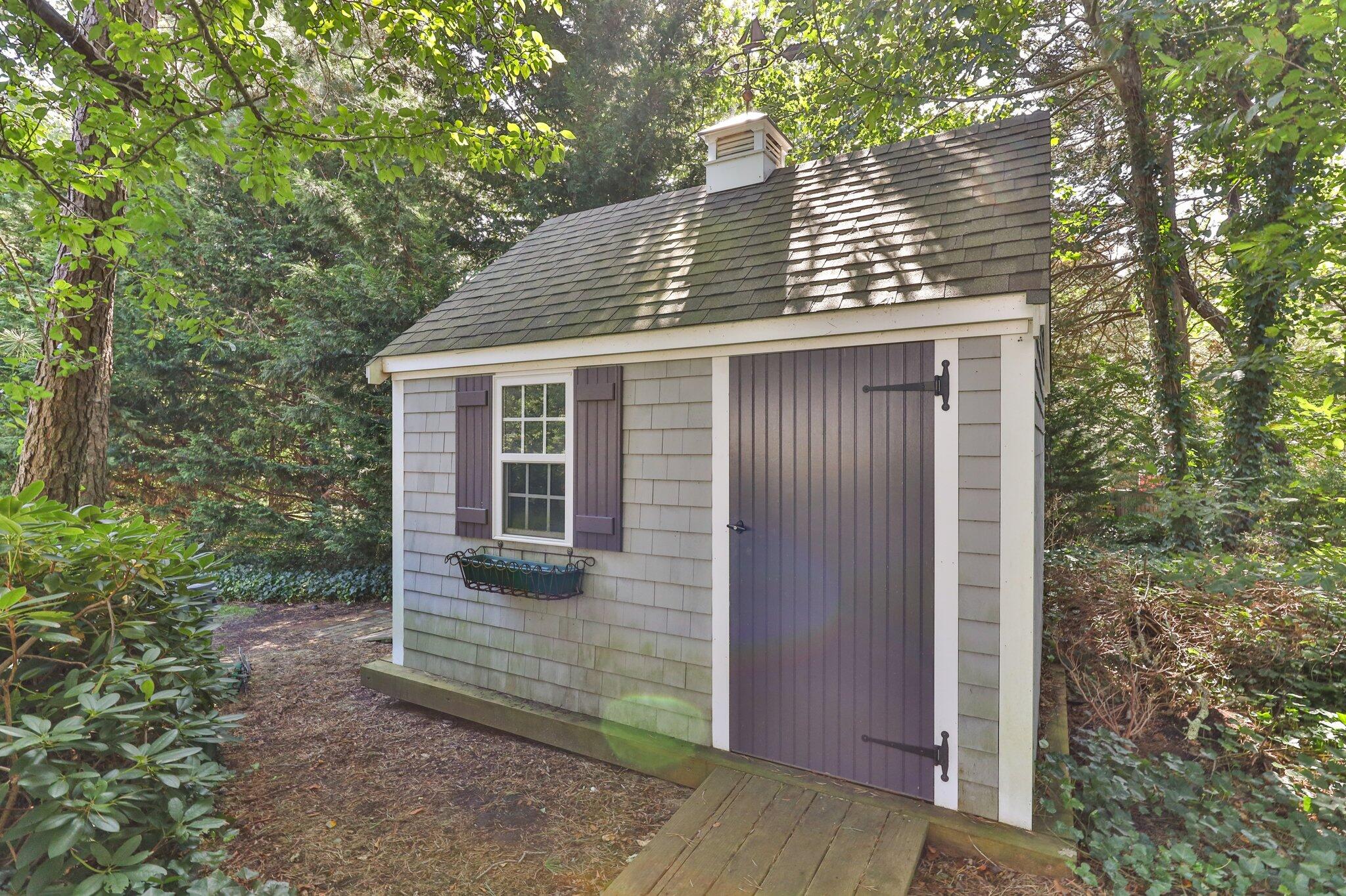 9 Briar Spring Road Orleans, MA 02653 - Photo 55 of 65 a front view of a house with a yard