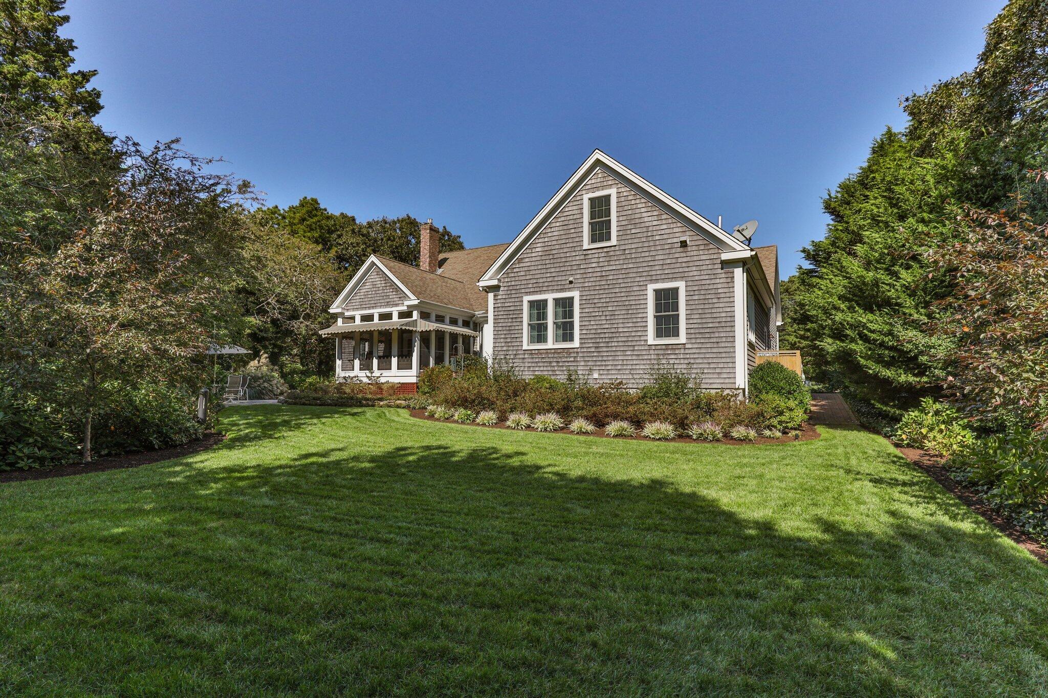 9 Briar Spring Road Orleans, MA 02653 - Photo 56 of 65 a front view of a house with a yard