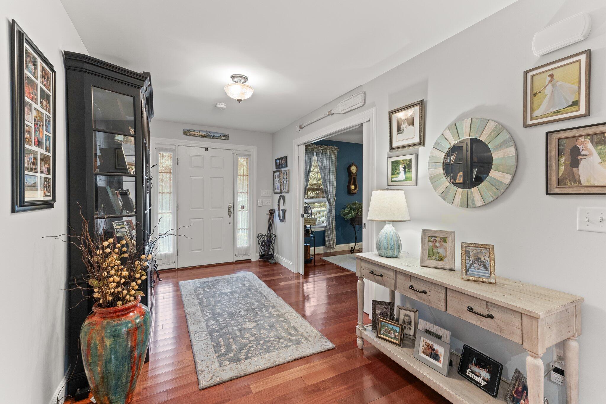 9 Briar Spring Road Orleans, MA 02653 - Photo 10 of 65 a living room with furniture and a wooden floor
