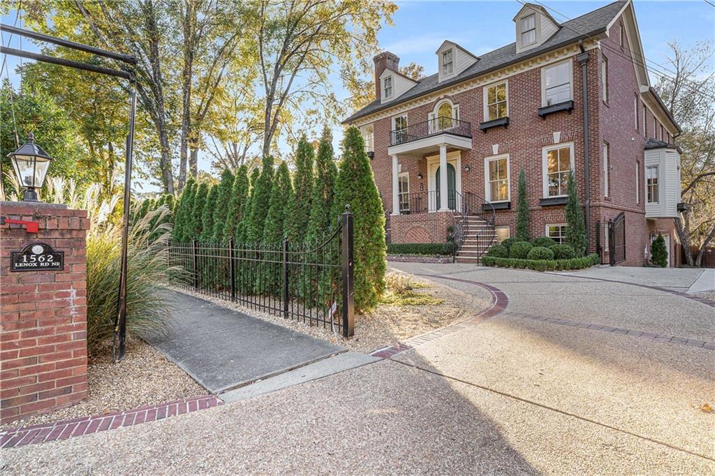 front view of a house with a garden