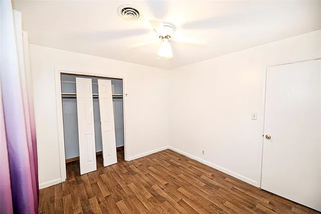 a bathroom with a granite countertop toilet sink and a bathtub
