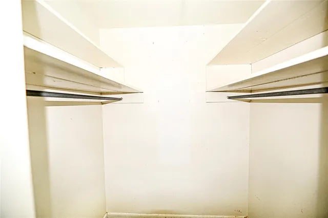 a bathroom with a sink toilet and a mirror