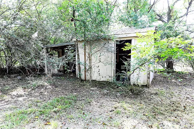 a backyard of a house with lots of green space
