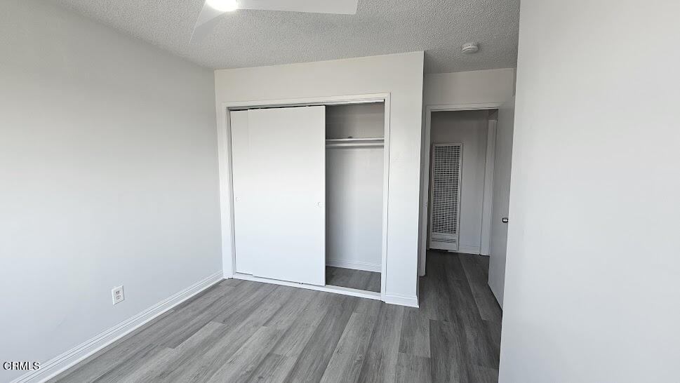 1710 Vine Street, Unit H Alhambra, CA 91801 - Photo 8 of 13 a view of an empty room with wooden floor and closet