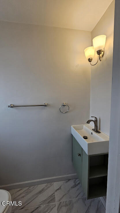 1710 Vine Street, Unit H Alhambra, CA 91801 - Photo 9 of 13 a bathroom with a sink and vanity