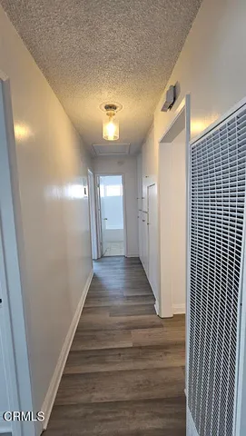 an empty room with wooden floor