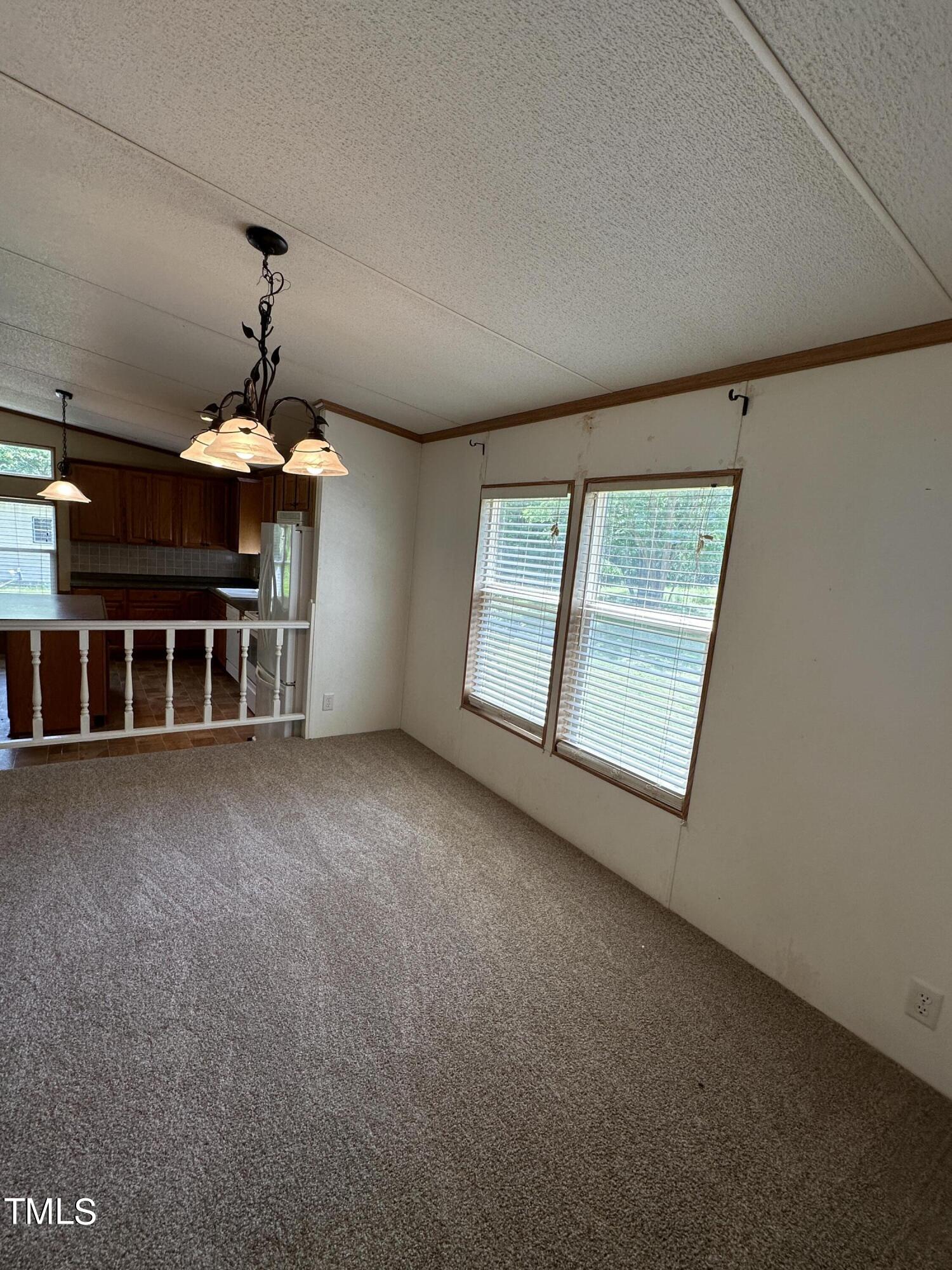 291 Pixley Pritchard Road Timberlake, NC 27583 - Photo 4 of 38 a view of a room with a ceiling fan and window