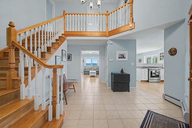 19 Eagle Crest Road Sebago, ME 04029 - Photo 11 of 62 Cathedral Ceiling Tiled Entry