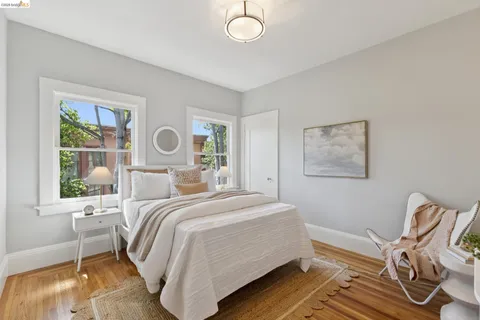 a bed room with a bed and a painting