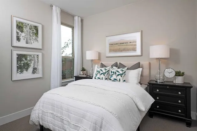 a view of a hallway with wooden floor and closet