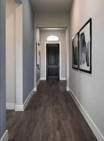 a room with cabinets table and window