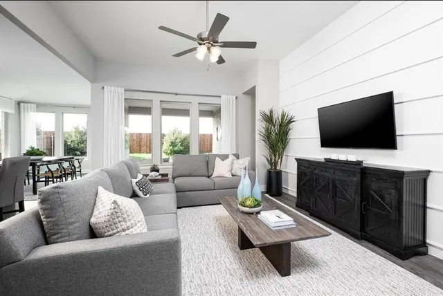 a kitchen with granite countertop stainless steel appliances a stove and cabinets