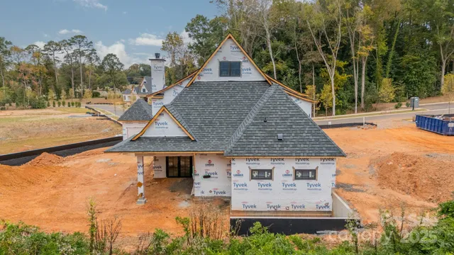 an aerial view of a house with yard swimming pool and outdoor seating