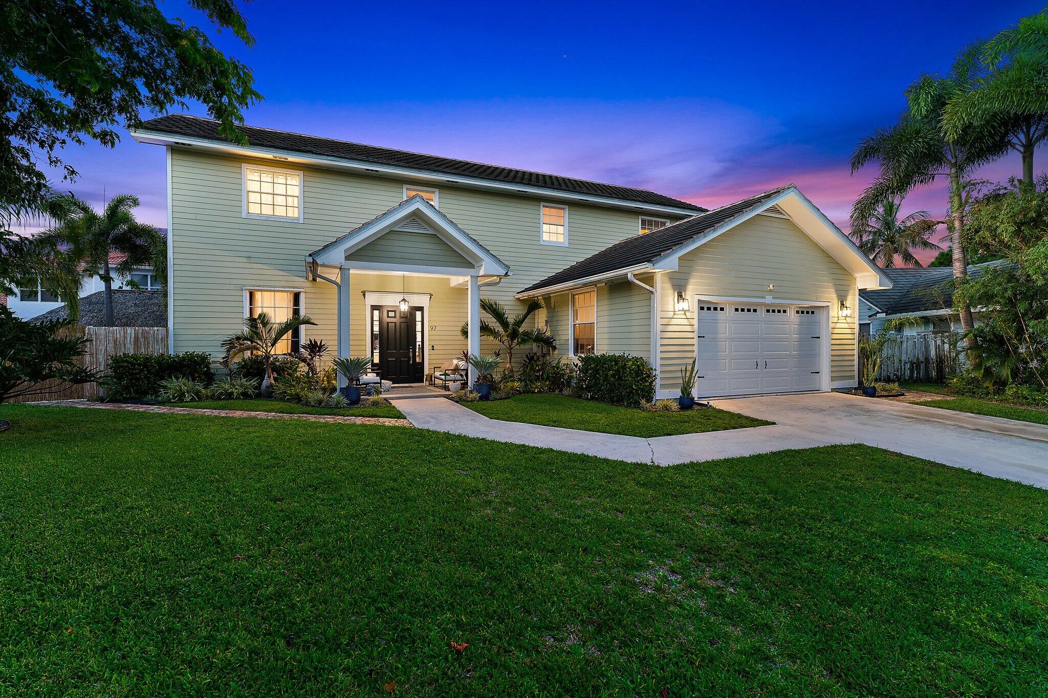 97 Beechwood Trail Tequesta, FL 33469 - Photo 17 of 113 a view of a house with a big yard