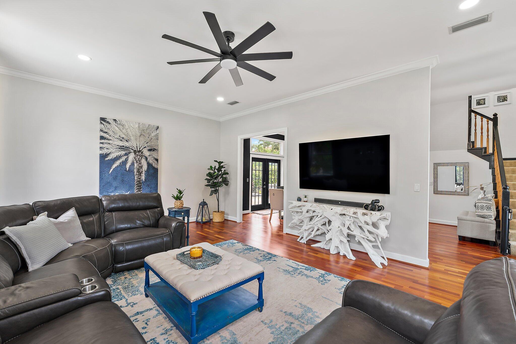 97 Beechwood Trail Tequesta, FL 33469 - Photo 63 of 113 a living room with furniture and a flat screen tv