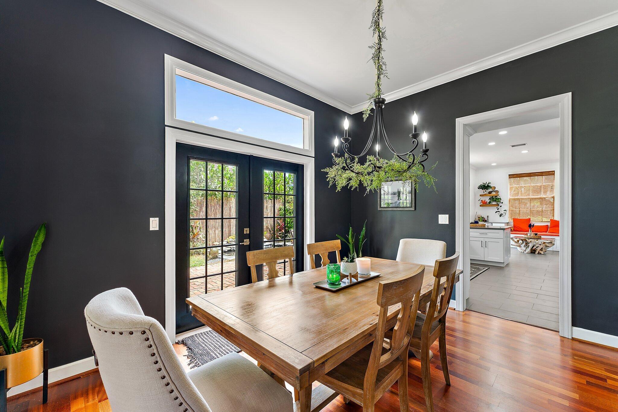 97 Beechwood Trail Tequesta, FL 33469 - Photo 67 of 113 a view of a dining room with furniture window and wooden floor