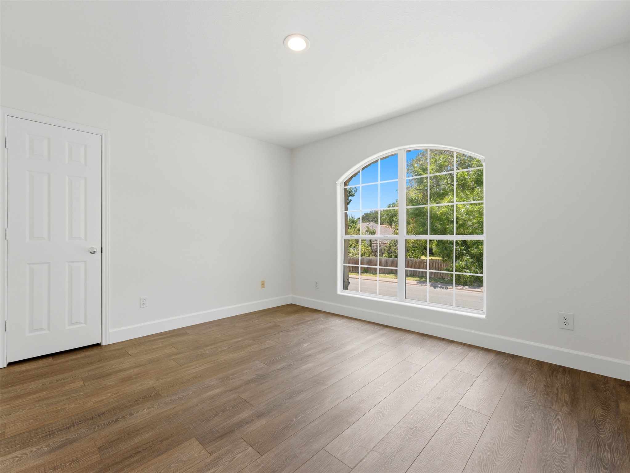 15207 Natural Spring Way Austin, TX 78728 - Photo 26 of 40 This charming secondary bedroom comes with an arching picture window overlooking the front yard and a generous walk-in closet.