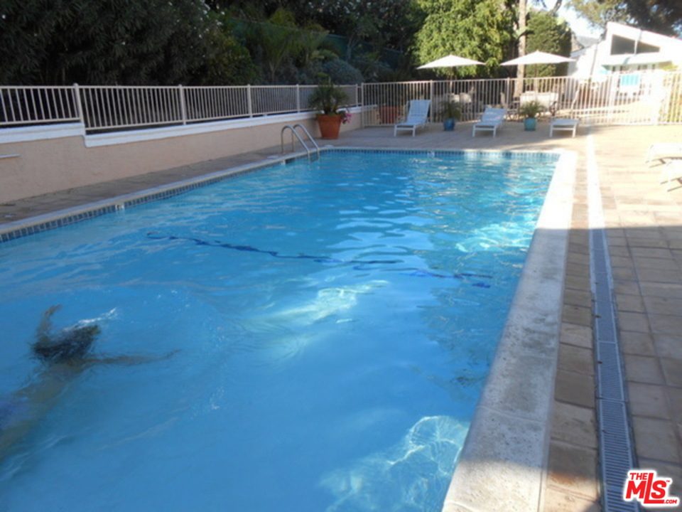 26664 Seagull Way, Unit A105 Malibu, CA 90265 - Photo 18 of 23 a view of a swimming pool with a patio